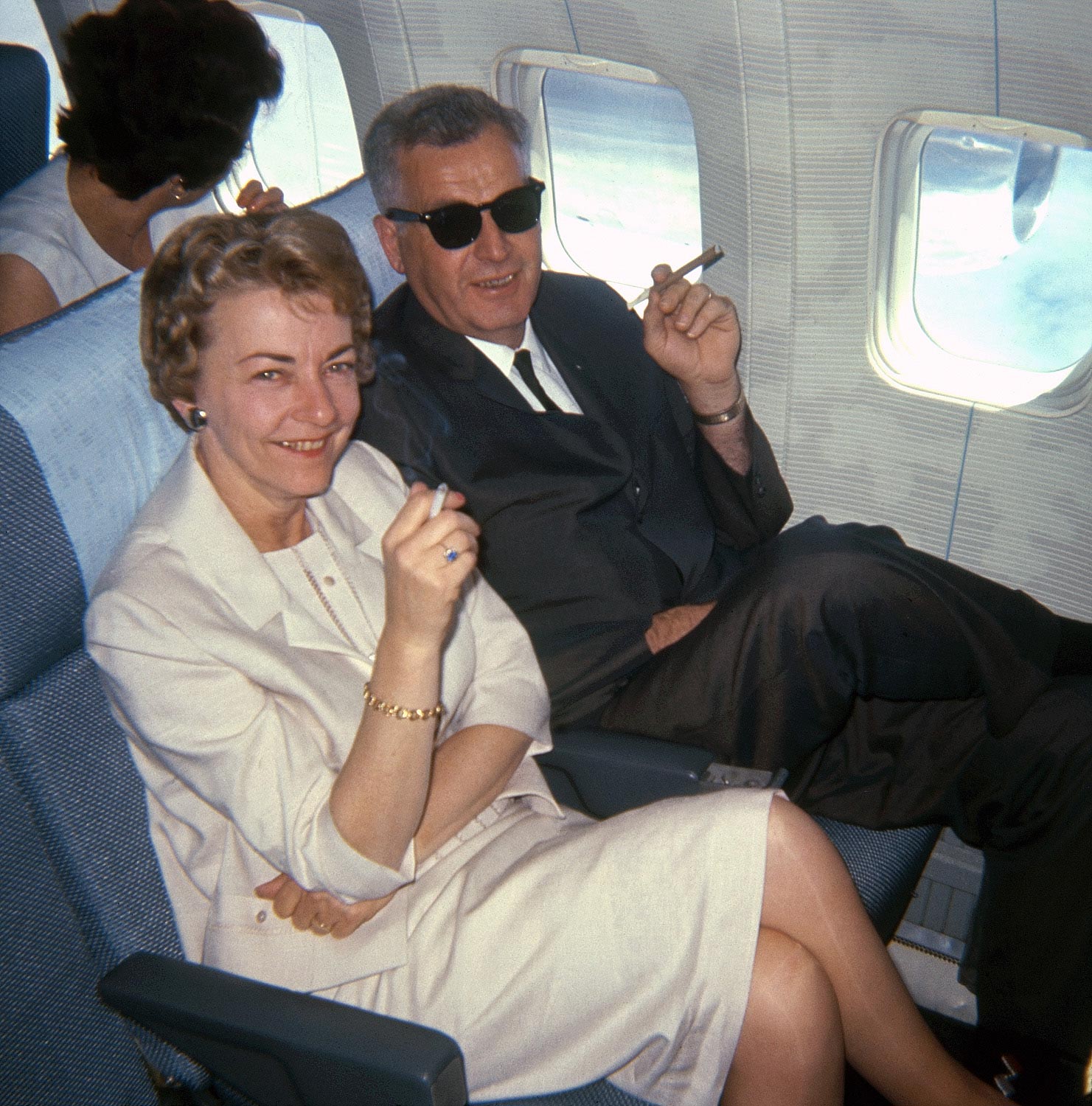 Older couple Smoking on a Plane