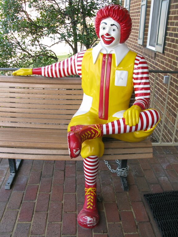 Ronald McDonald sitting on the Bench